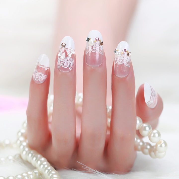Elegant artificial nails with tip pattern and pearl embellishment Stornfield