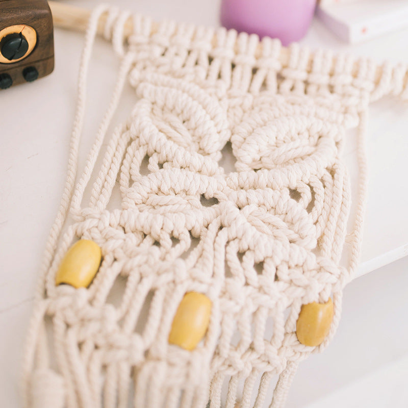 Macrame phone pouch with wooden beads, leaf relief and hanging loop Stornfield