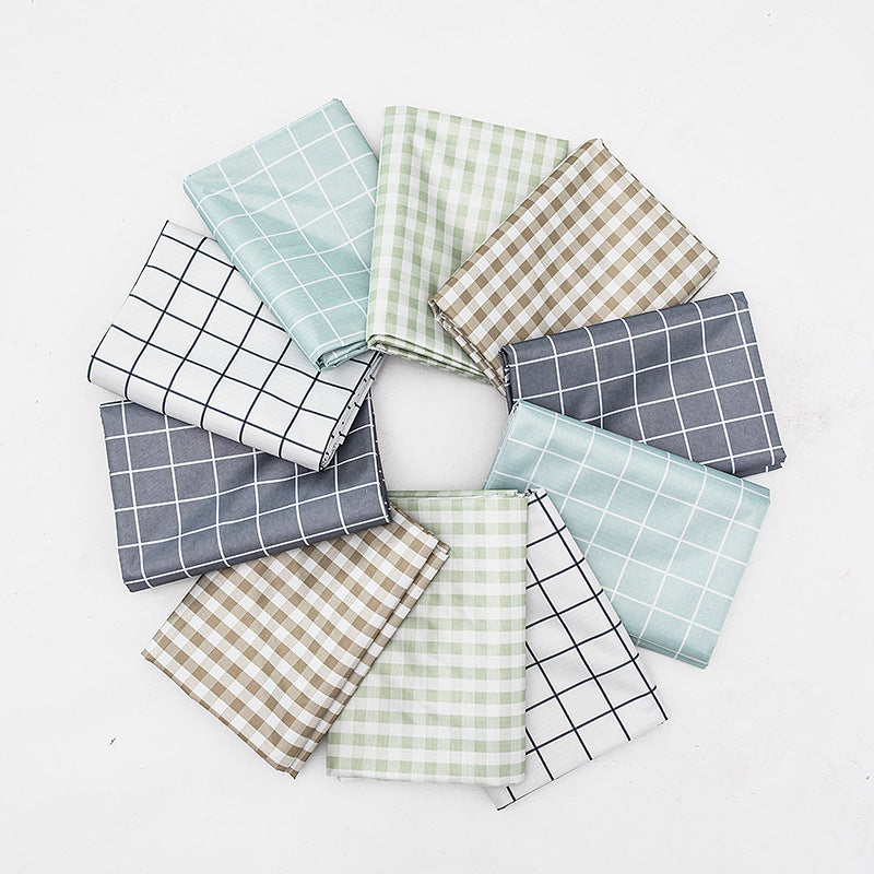 Wipeable tablecloth with fine check pattern, wavy hem and easy-care PVC finish Stornfield