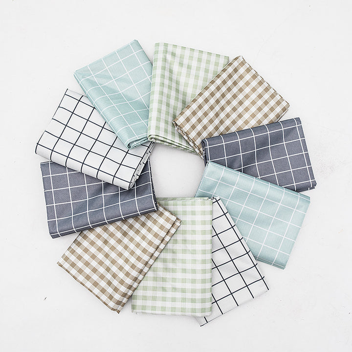 Wipeable tablecloth with fine check pattern, wavy hem and easy-care PVC finish Stornfield