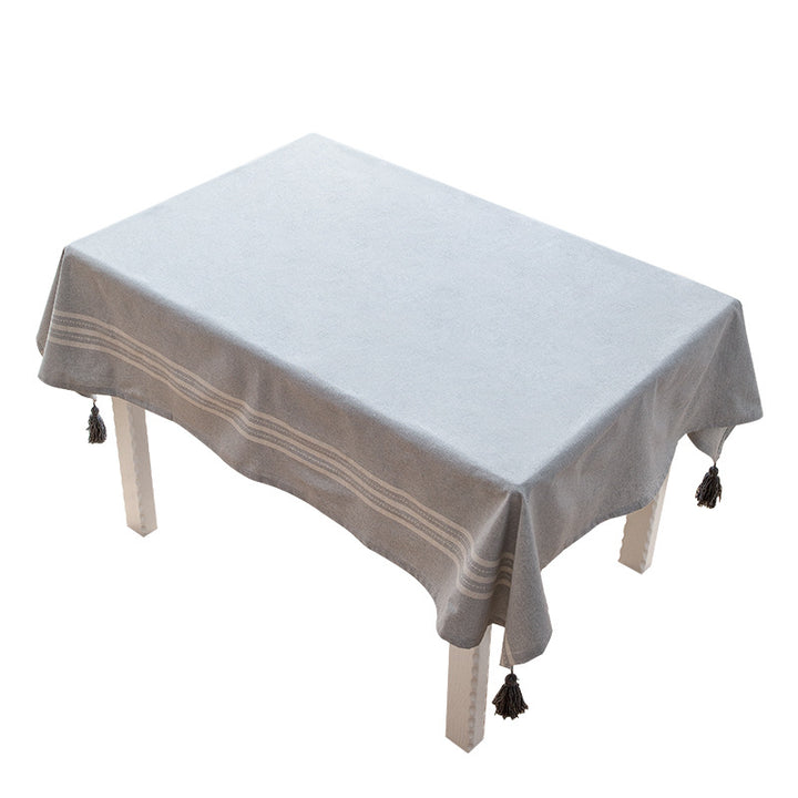 Rectangular linen look tablecloth with fringed tassels and side stripe border design Stornfield