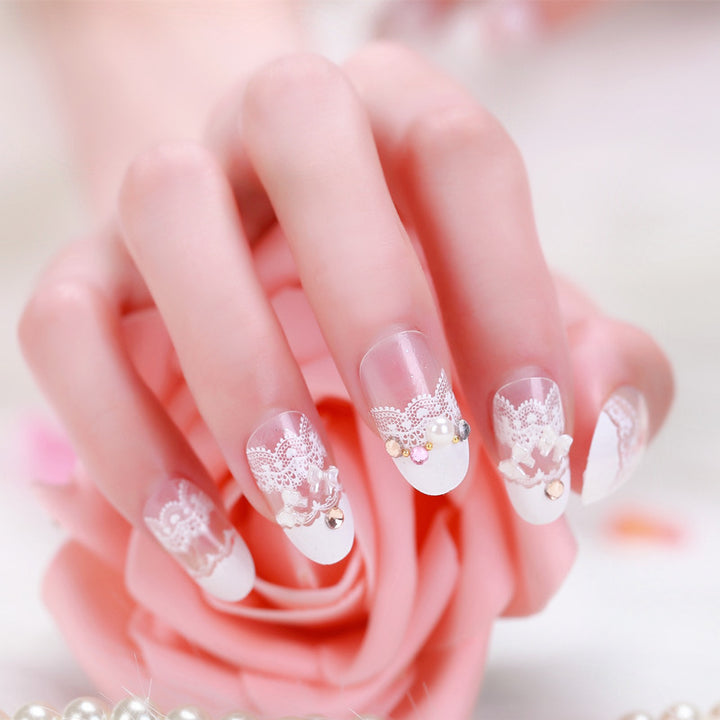 Elegant artificial nails with tip pattern and pearl embellishment Stornfield