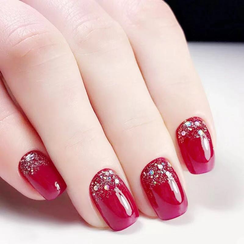 Glamorous artificial nails with glitter accents Stornfield