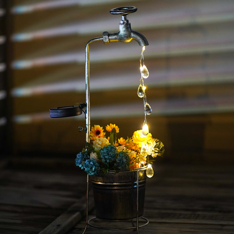 Modern Art Deco Solar Faucet Water Drops Flowing Water Planter Shape Iron LED Outdoor Light For Garden | Stornfield