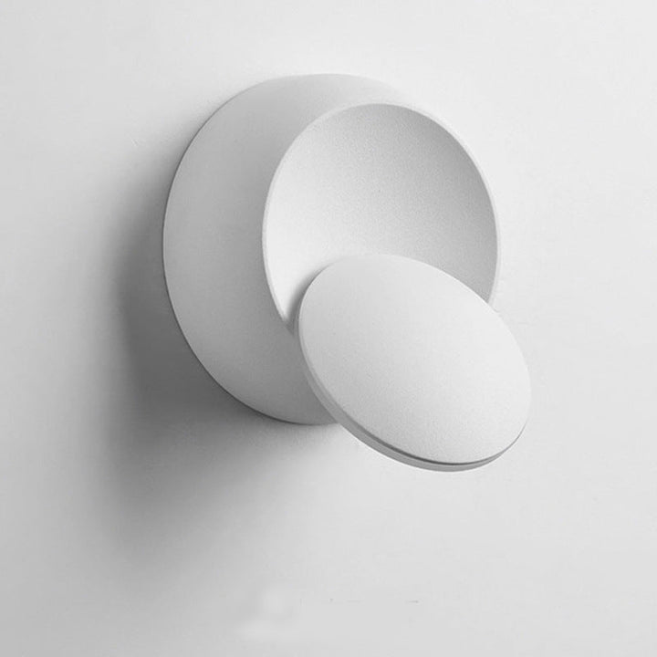 Stornfield | Contemporary Nordic Iron Rotating Eclipse Round LED Wall Sconce for Bedside