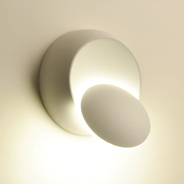 Stornfield | Contemporary Nordic Iron Rotating Eclipse Round LED Wall Sconce for Bedside