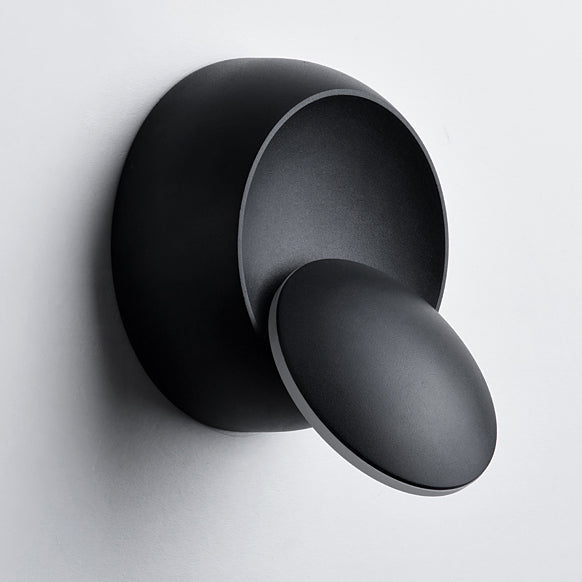 Stornfield | Contemporary Nordic Iron Rotating Eclipse Round LED Wall Sconce for Bedside