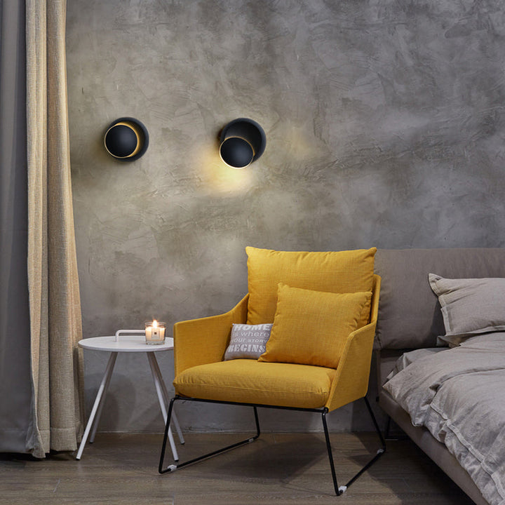Stornfield | Contemporary Nordic Iron Rotating Eclipse Round LED Wall Sconce for Bedside