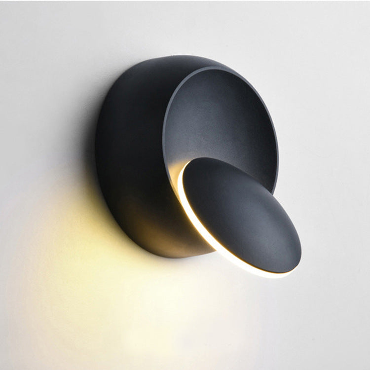 Stornfield | Contemporary Nordic Iron Rotating Eclipse Round LED Wall Sconce for Bedside