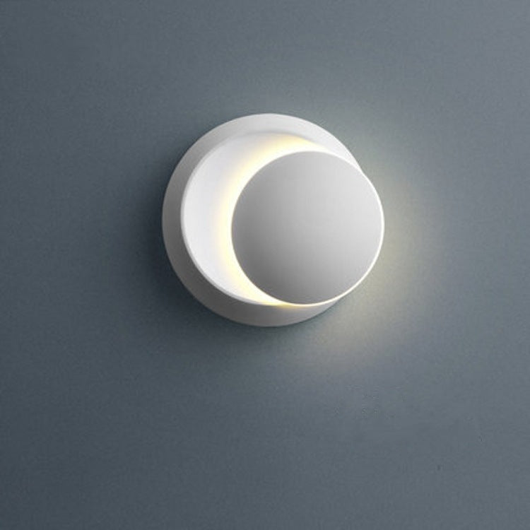 Stornfield | Contemporary Nordic Iron Rotating Eclipse Round LED Wall Sconce for Bedside