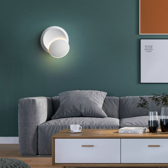 Stornfield | Contemporary Nordic Iron Rotating Eclipse Round LED Wall Sconce for Bedside