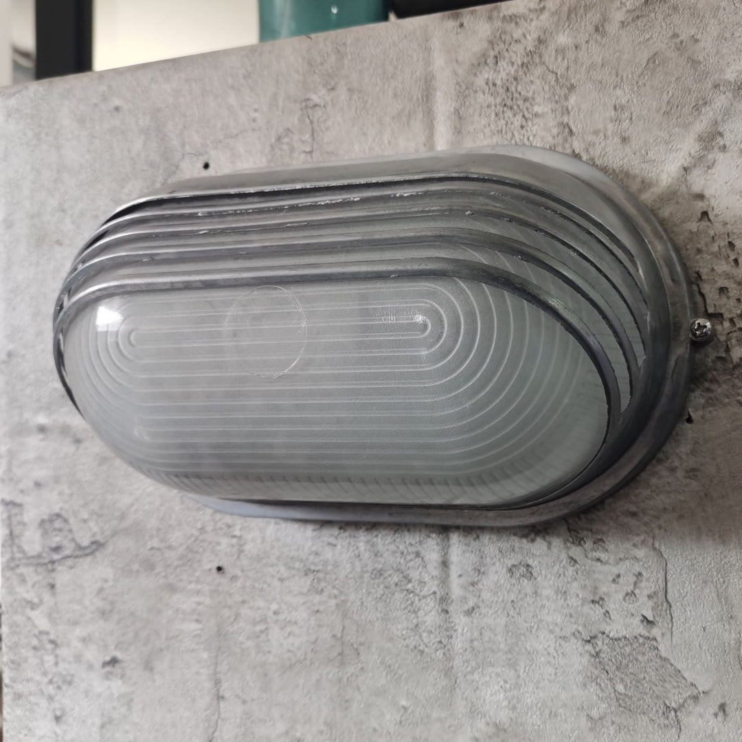 Contemporary Industrial Waterproof Aluminum Glass Frosted Oval Striped 1-Light Wall Sconce Lamp For Outdoor Patio | Stornfield