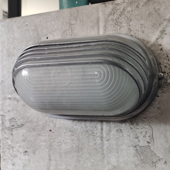 Contemporary Industrial Waterproof Aluminum Glass Frosted Oval Striped 1-Light Wall Sconce Lamp For Outdoor Patio | Stornfield