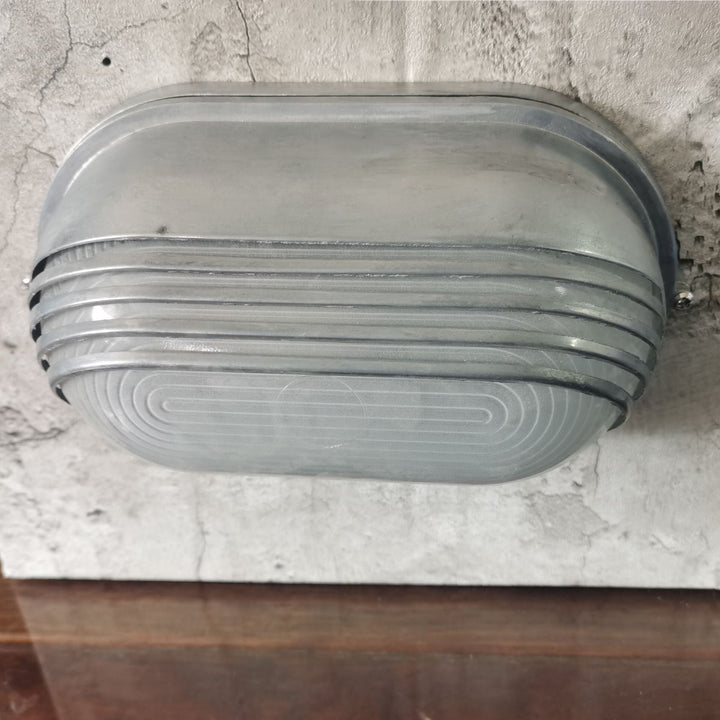 Contemporary Industrial Waterproof Aluminum Glass Frosted Oval Striped 1-Light Wall Sconce Lamp For Outdoor Patio | Stornfield