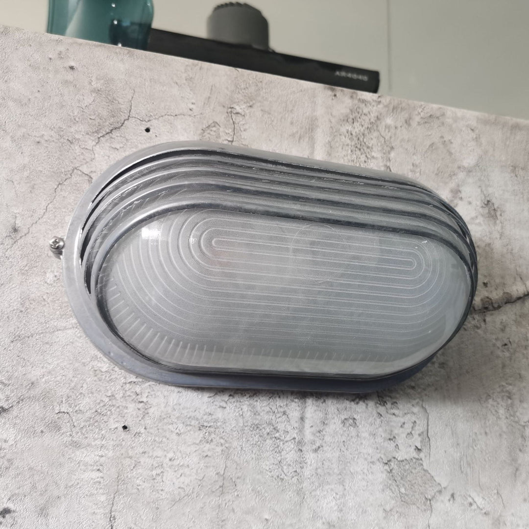 Contemporary Industrial Waterproof Aluminum Glass Frosted Oval Striped 1-Light Wall Sconce Lamp For Outdoor Patio | Stornfield