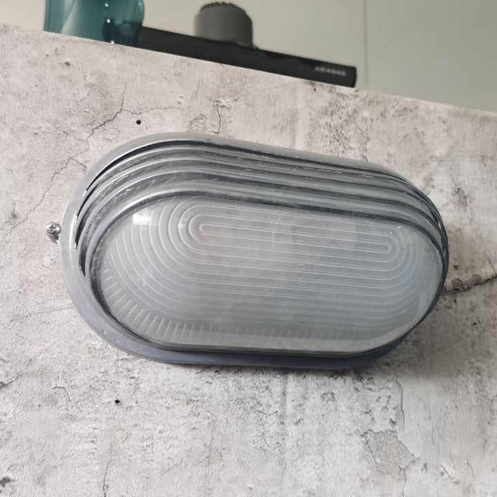 Contemporary Industrial Waterproof Aluminum Glass Frosted Oval Striped 1-Light Wall Sconce Lamp For Outdoor Patio | Stornfield