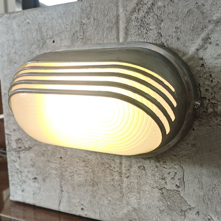 Contemporary Industrial Waterproof Aluminum Glass Frosted Oval Striped 1-Light Wall Sconce Lamp For Outdoor Patio | Stornfield