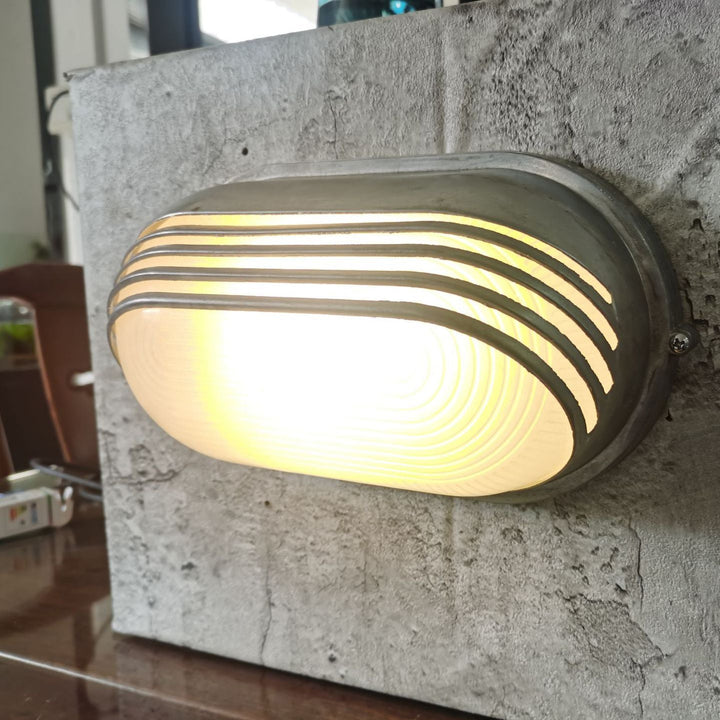Contemporary Industrial Waterproof Aluminum Glass Frosted Oval Striped 1-Light Wall Sconce Lamp For Outdoor Patio | Stornfield