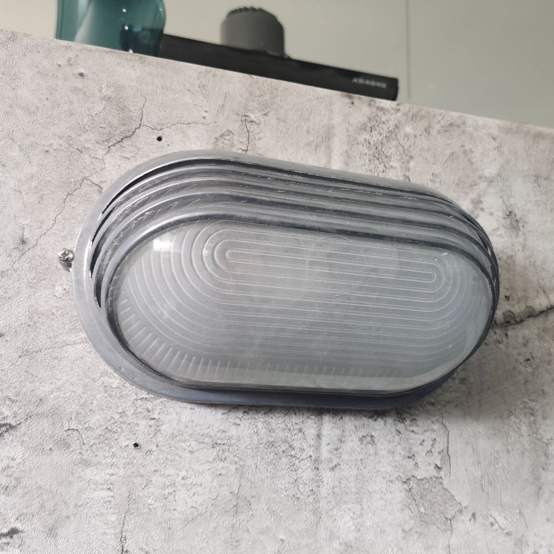 Contemporary Industrial Waterproof Aluminum Glass Frosted Oval Striped 1-Light Wall Sconce Lamp For Outdoor Patio | Stornfield