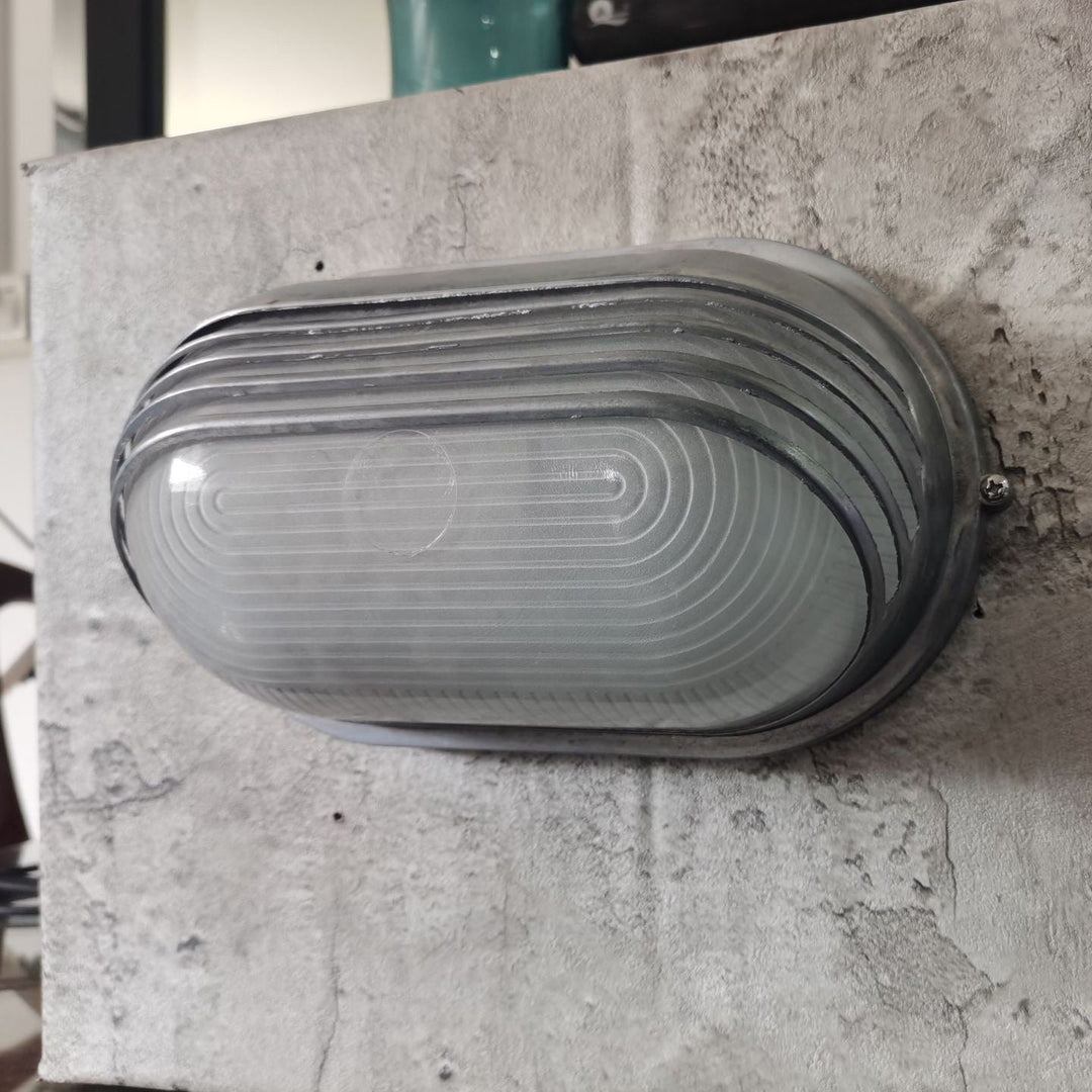Contemporary Industrial Waterproof Aluminum Glass Frosted Oval Striped 1-Light Wall Sconce Lamp For Outdoor Patio | Stornfield