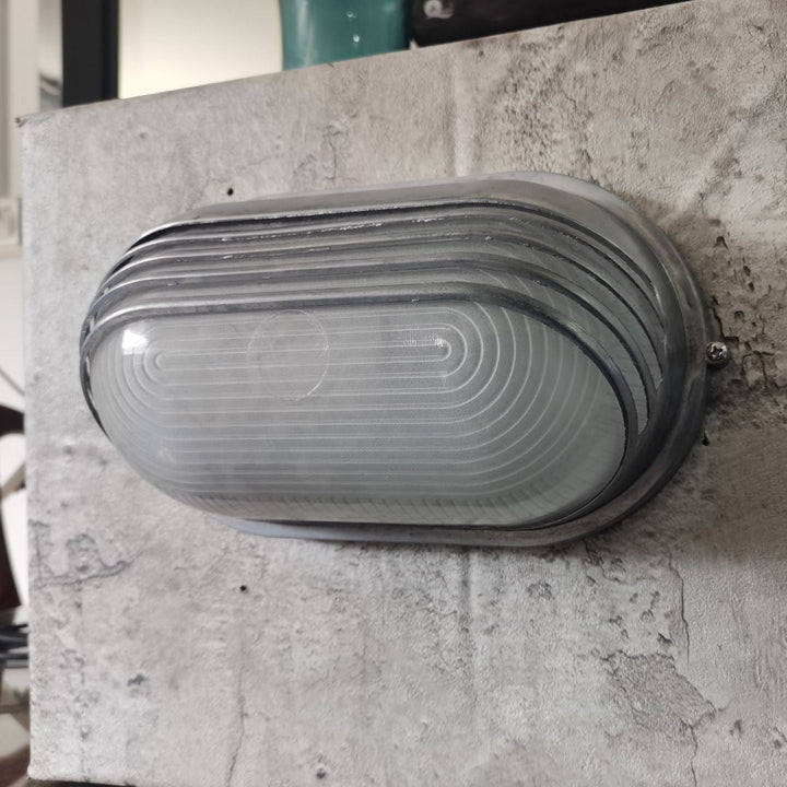 Contemporary Industrial Waterproof Aluminum Glass Frosted Oval Striped 1-Light Wall Sconce Lamp For Outdoor Patio | Stornfield