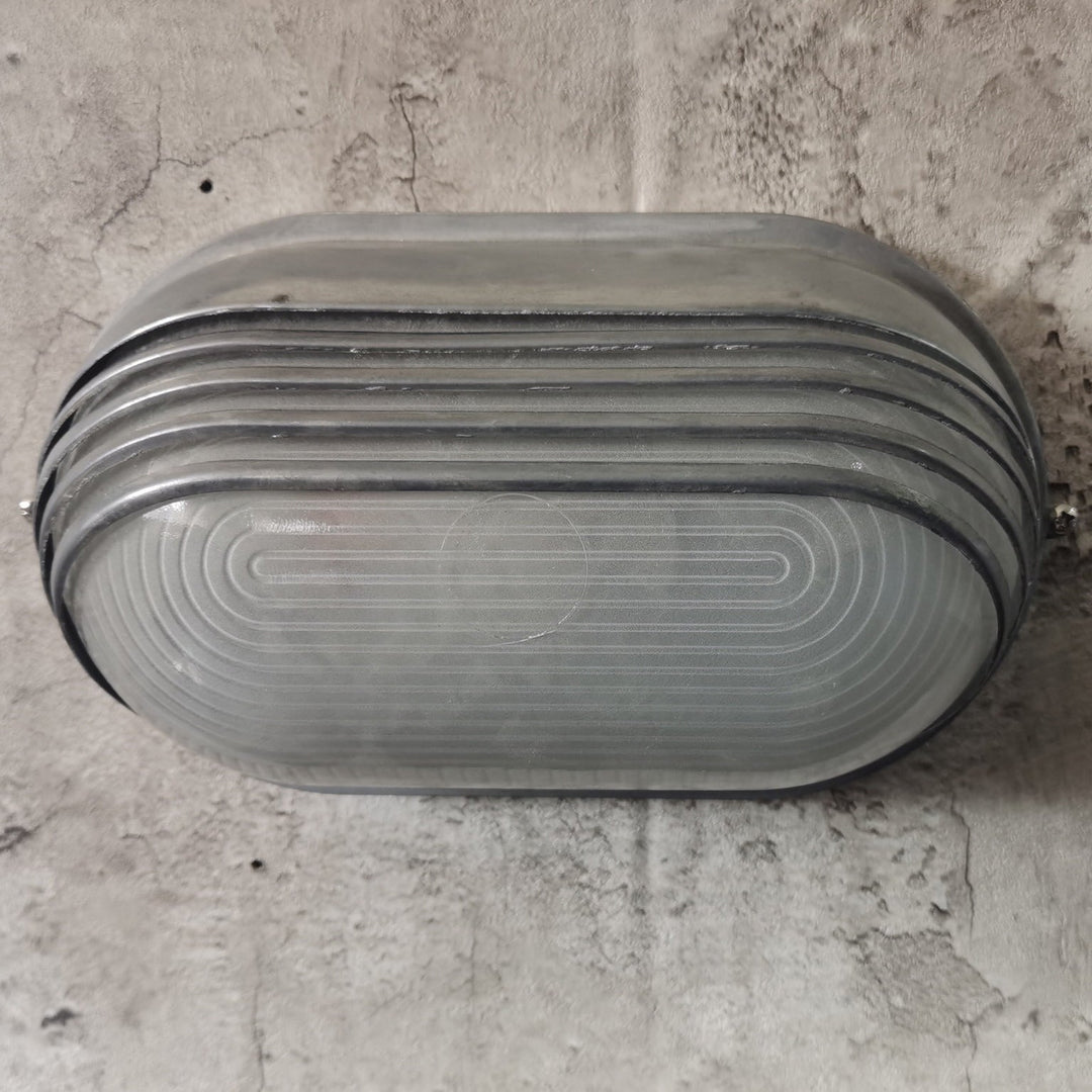 Contemporary Industrial Waterproof Aluminum Glass Frosted Oval Striped 1-Light Wall Sconce Lamp For Outdoor Patio | Stornfield
