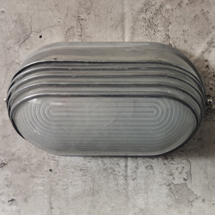 Contemporary Industrial Waterproof Aluminum Glass Frosted Oval Striped 1-Light Wall Sconce Lamp For Outdoor Patio | Stornfield