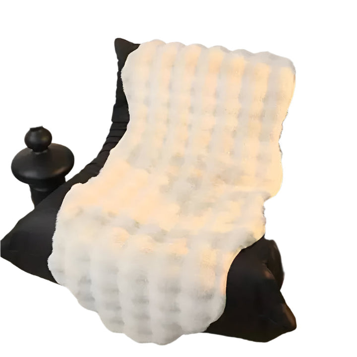 Ultra-soft plush throw with non-slip Stornfield backing