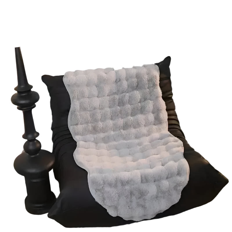 Ultra-soft plush throw with non-slip Stornfield backing
