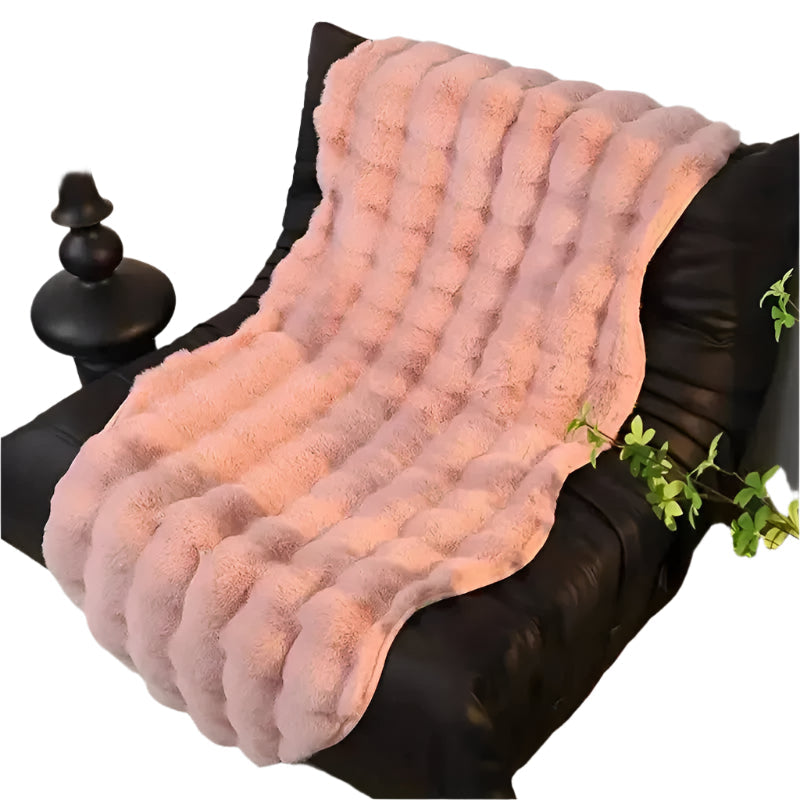 Ultra-soft plush throw with non-slip Stornfield backing