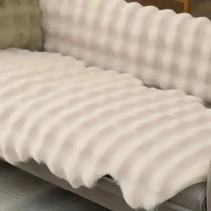 Ultra-soft plush throw with non-slip Stornfield backing