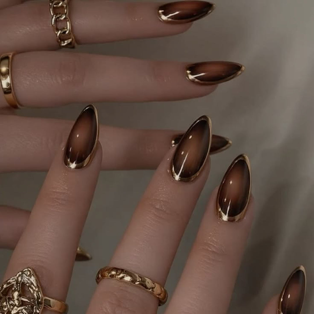 Glamorous Stiletto Nails with Elegant Gold Edge Stornfield