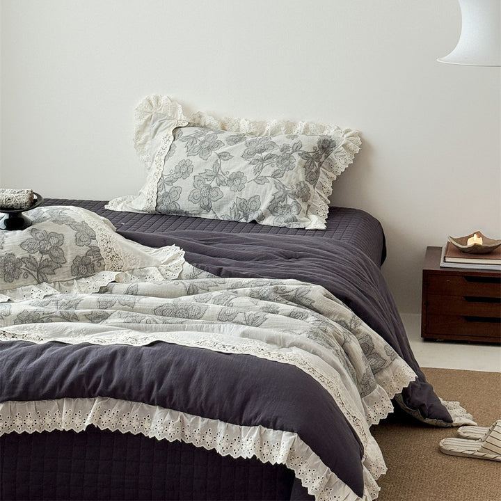 Vintage cotton bedding set with lace trim and hand-drawn floral pattern