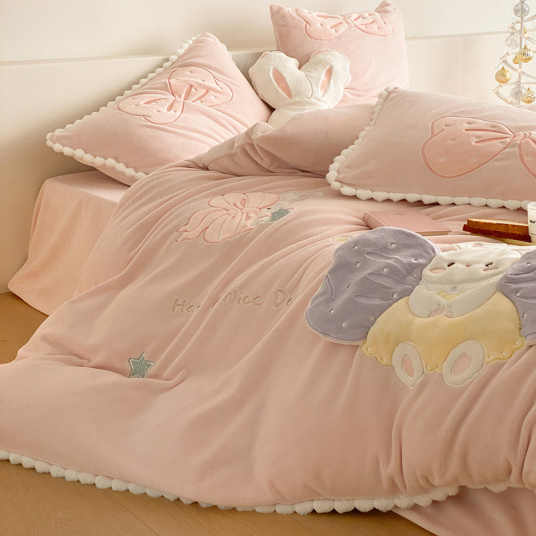Cozy quilted bedding set with plush appliqué and pompom trim