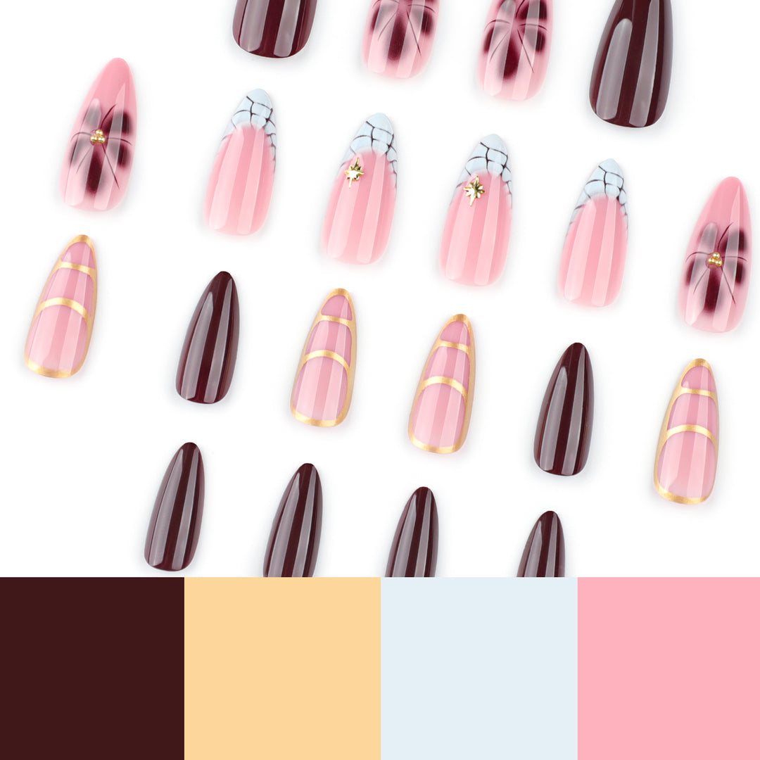 Artful Stiletto nails with gold accents and decorative floral designs Stornfield
