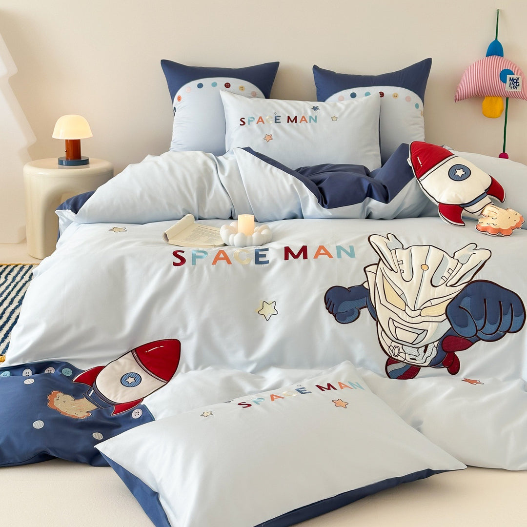 Children's bedding set with embroidered comic design and striped details
