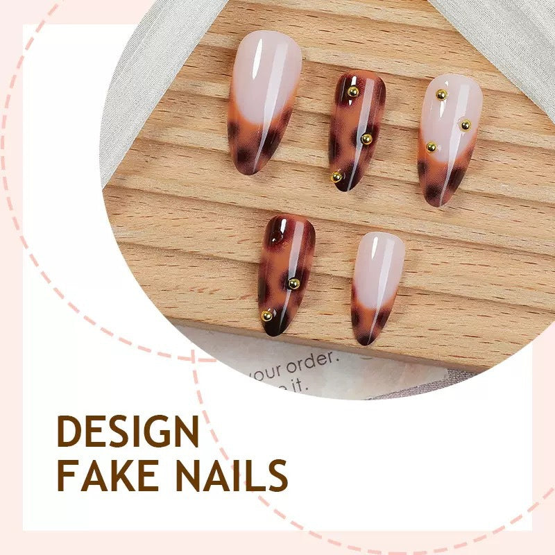Acrylic nail set with luxurious leopard pattern and golden accents Stornfield