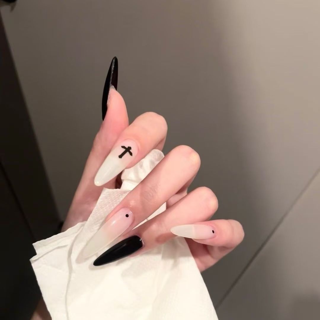 Gothic-Inspired Long Almond Nail Art Stornfield