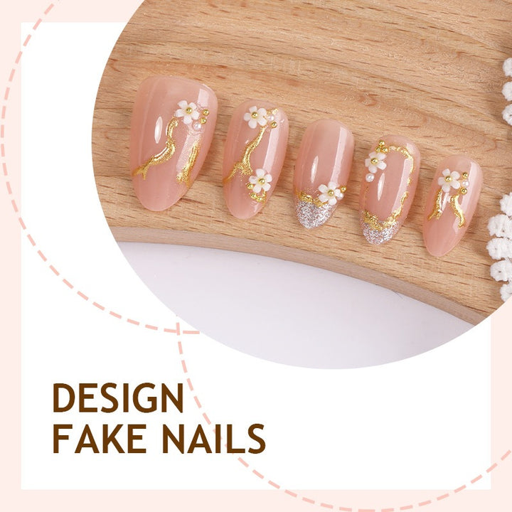 Creative nail art set with delicate flower decoration and glitter elements Stornfield