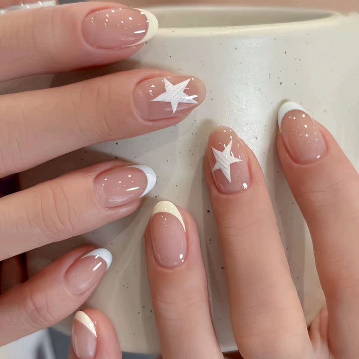 Elegant artificial nails with classic French tip and intricate star design Stornfield