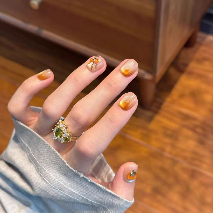 Artificial nails with elegant ombre effect and floral accents Stornfield