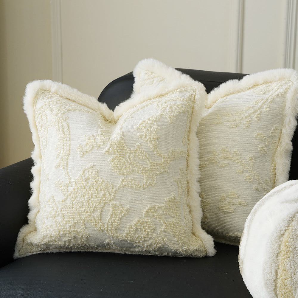 Square decorative pillow with embossed circular relief and soft faux fur edging