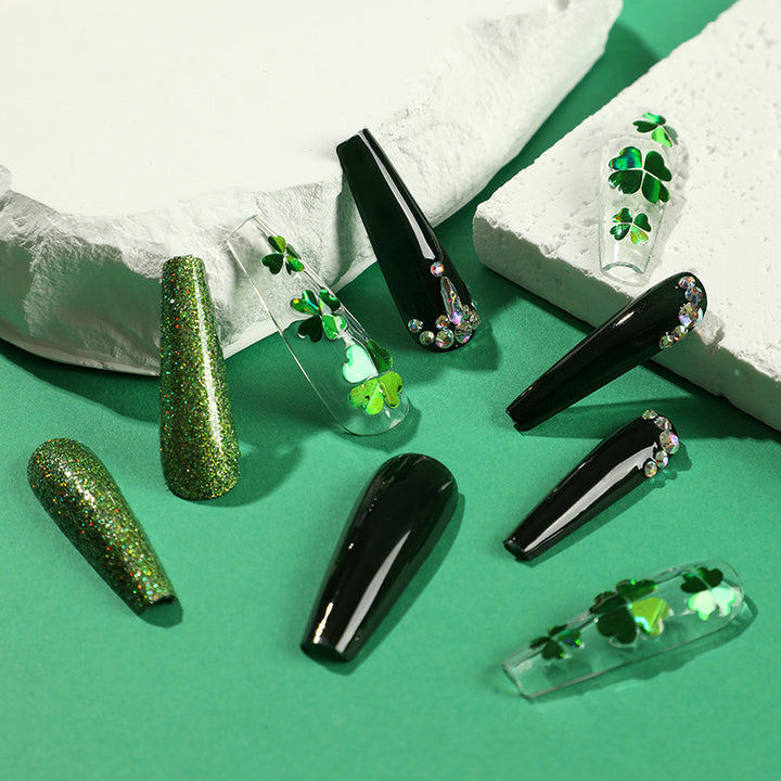 Artificial nail art with clover leaf motifs Stornfield