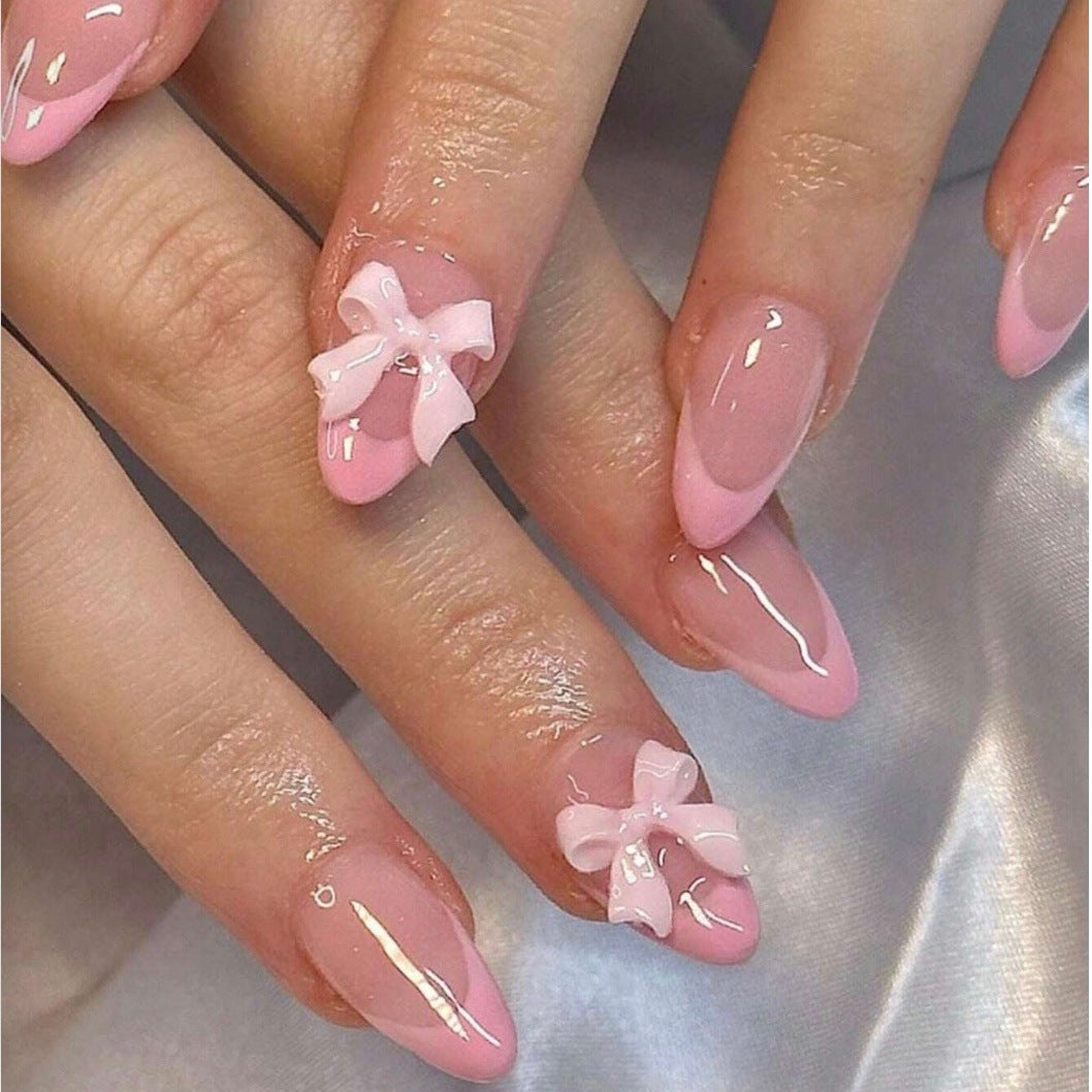 Nail art set with playful ribbons and shiny decorations Stornfield