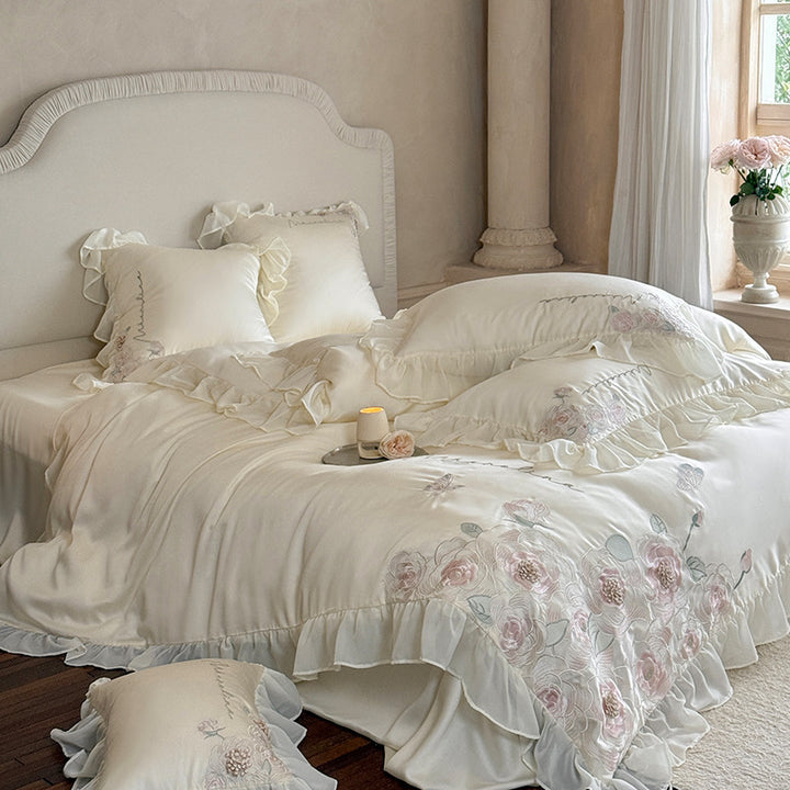 Luxurious satin bed linen set with relief-embroidered rose appliqués and ruffles
