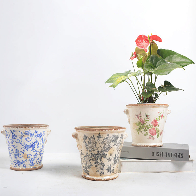 Decorative flower pot with floral embellishments Stornfield