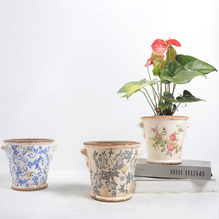 Decorative flower pot with floral embellishments Stornfield