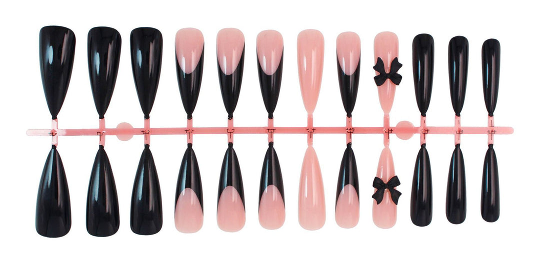Acrylic nail set with elegant black-and-white design and playful accents Stornfield