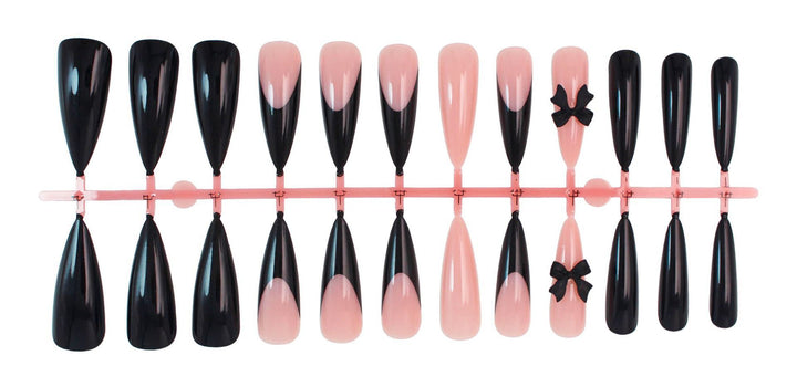 Acrylic nail set with elegant black-and-white design and playful accents Stornfield