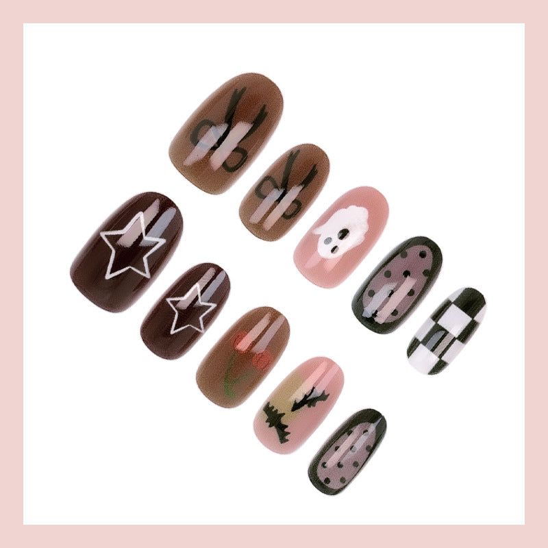 Artificial nail set with creative Halloween designs and glittering accents Stornfield